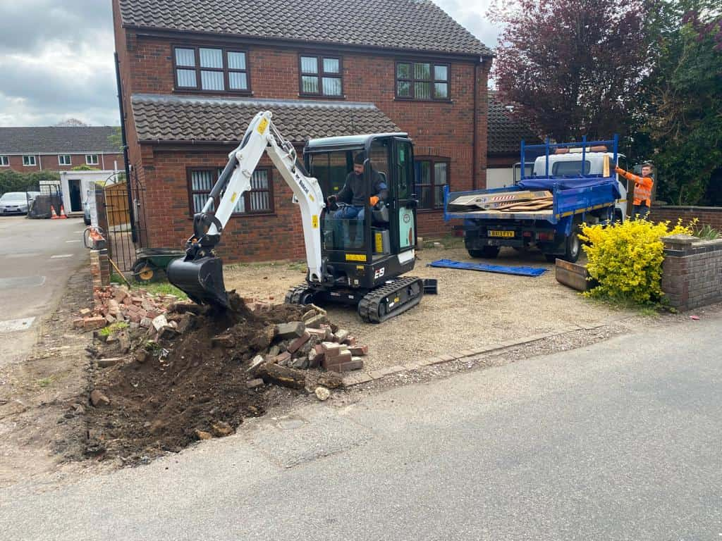 This is a photo of an operative of NS Driveways Ascot Digging out for a new tarmac driveway